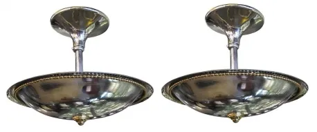 two antique hanging lamps with a shiny finish, round design