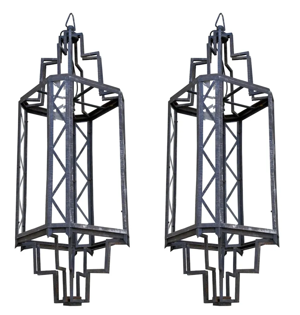 Pair of antique lanterns featuring unique decorative design.
