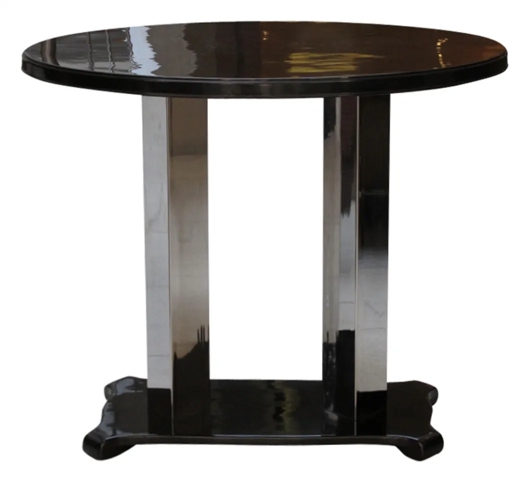 Antique round console table with elegant base in a neutral setting.