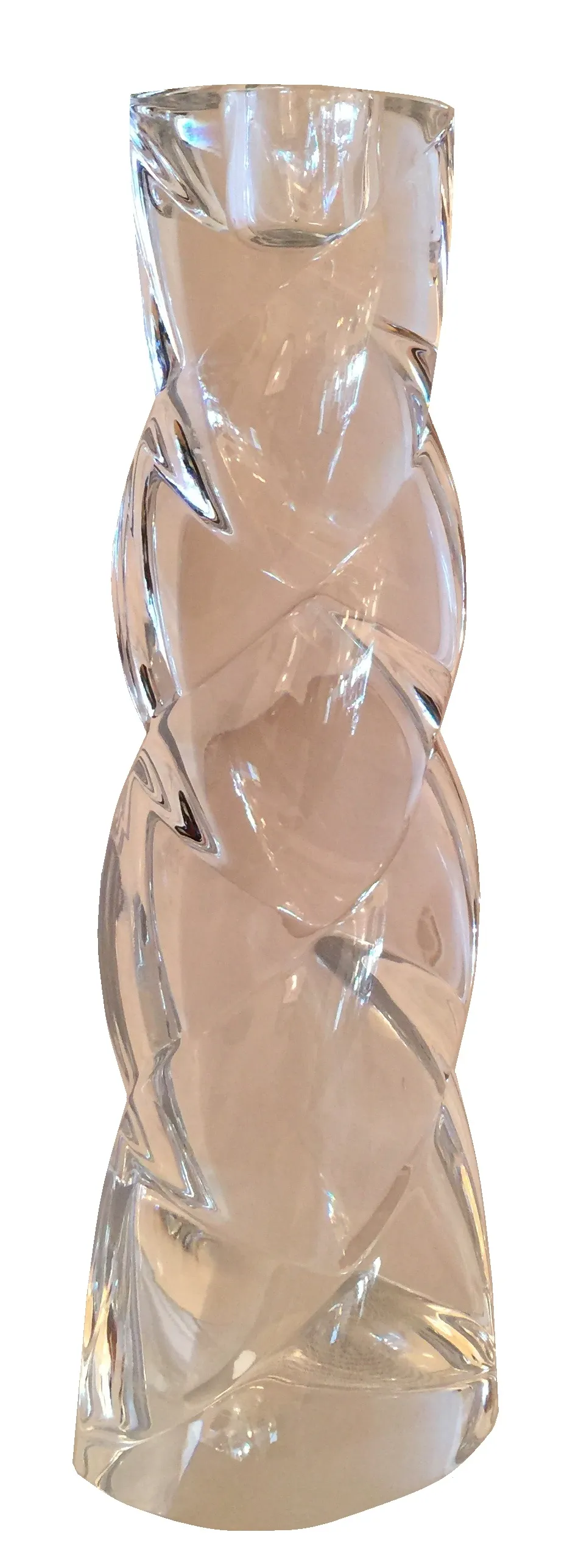 Antique Murano glass vase with spiral shapes, clear and shiny in a bright setting.