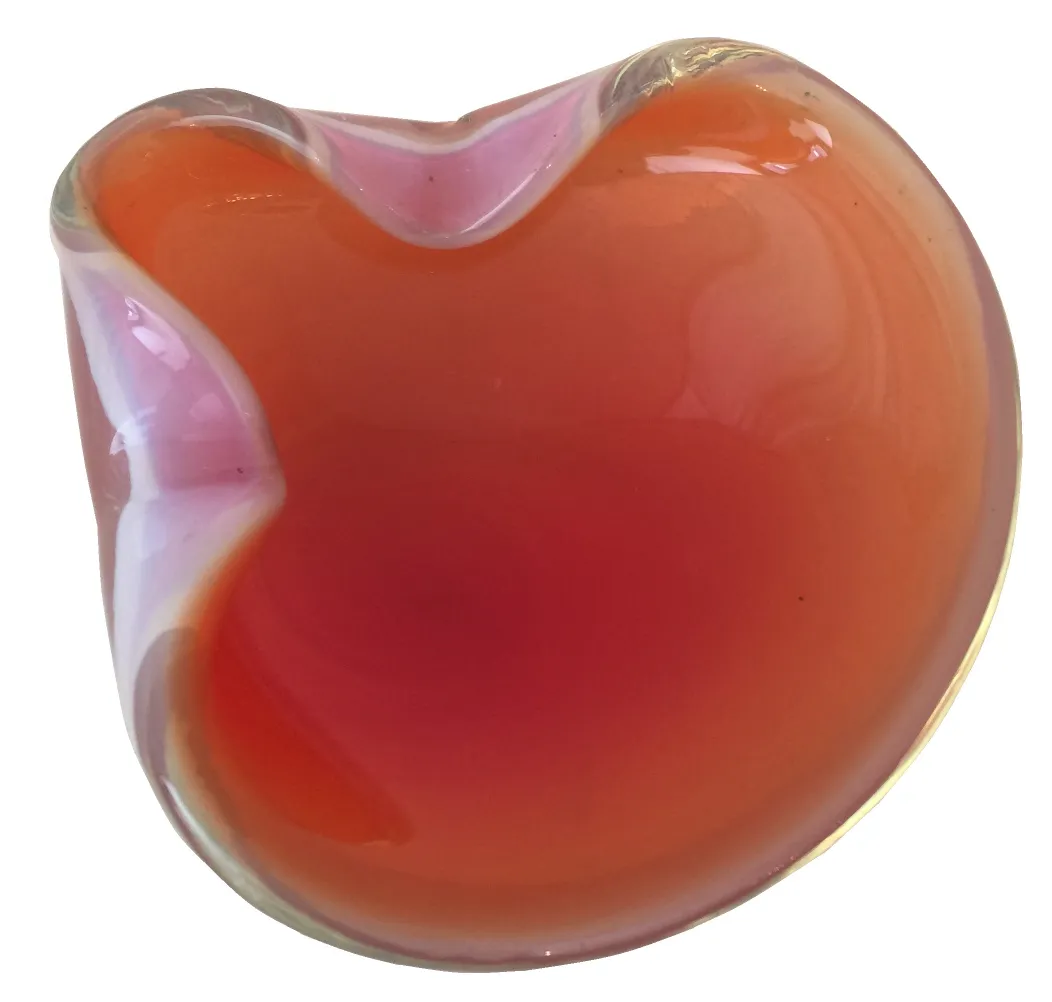 beautiful murano glass in an organic shape with warm colors