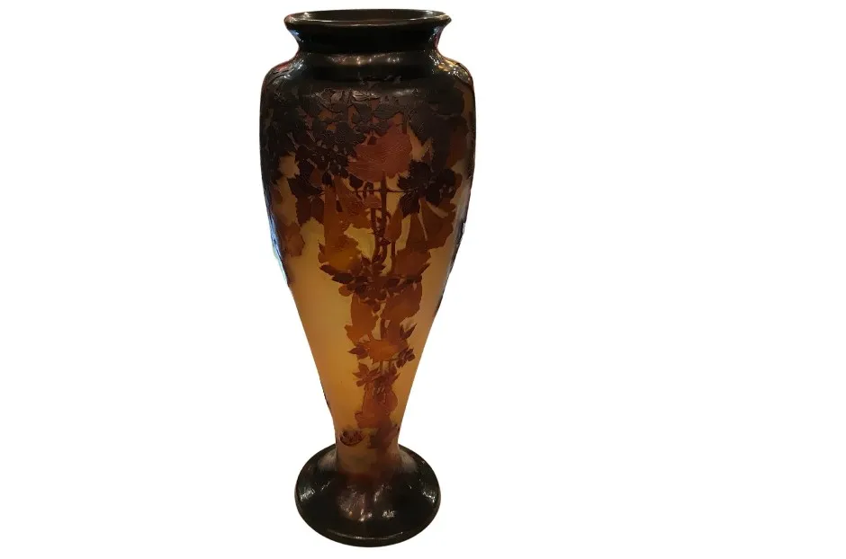 Antique vase with floral patterns in amber color.