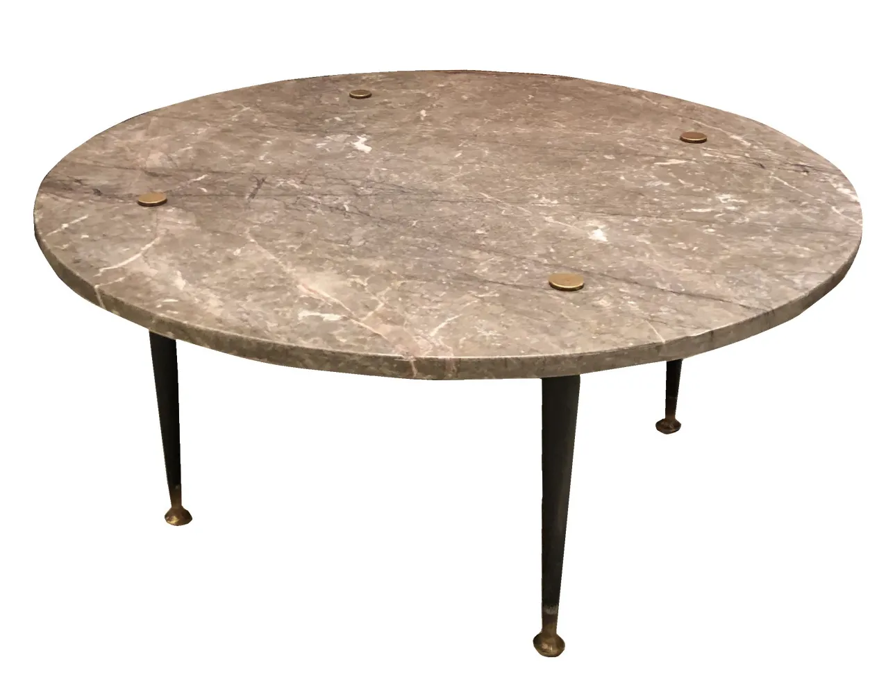 antique round coffee table in a warm setting with thin legs