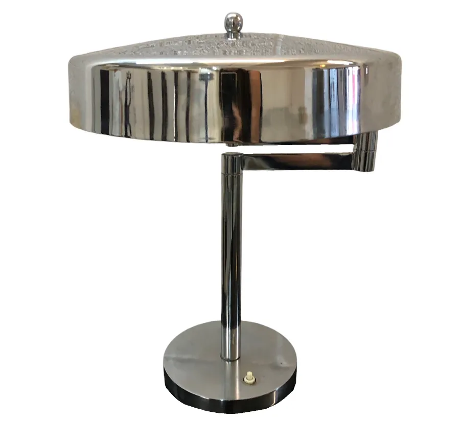 An antique table lamp with shiny finish and elegant design.