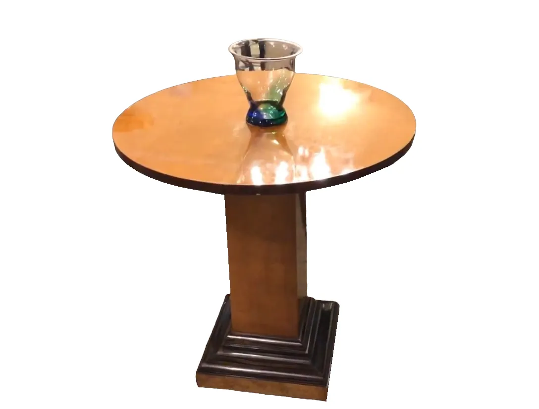 antique dining table for two with a decorative vase