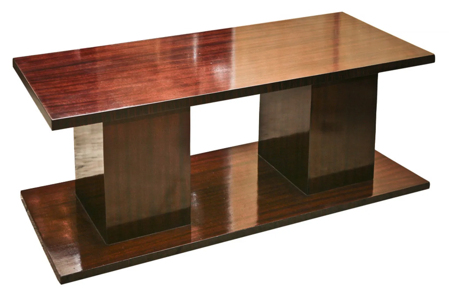antique coffee table with flat top and cube-shaped base, surrounded by decor