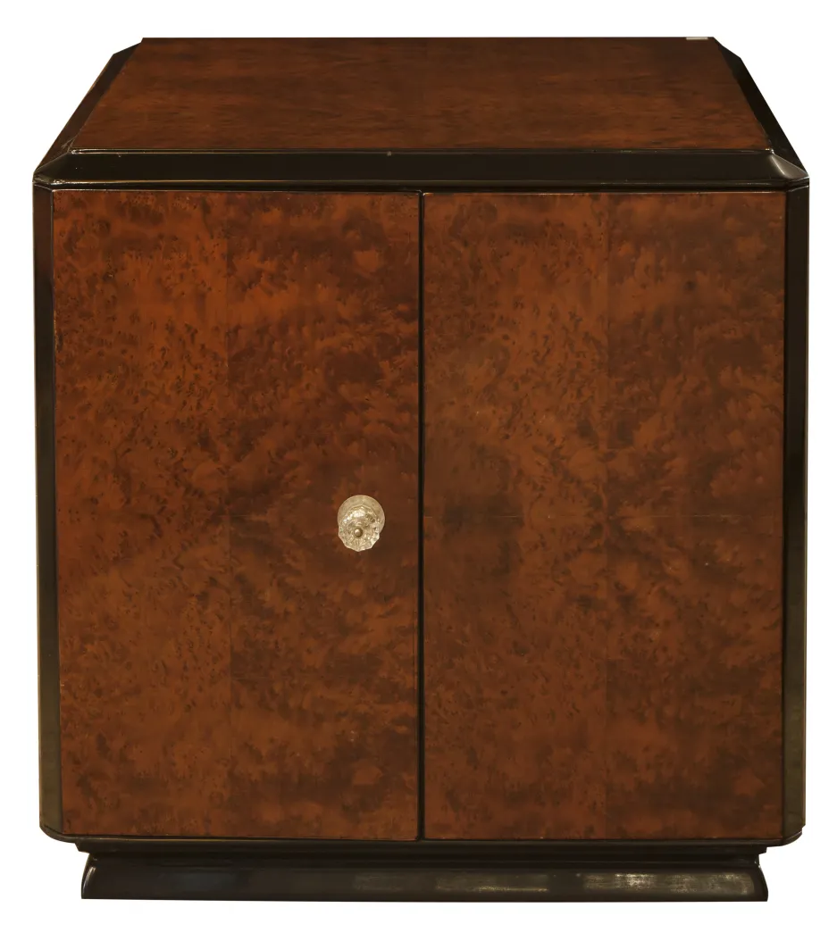 Antique bar cabinet made of wood with closed doors.