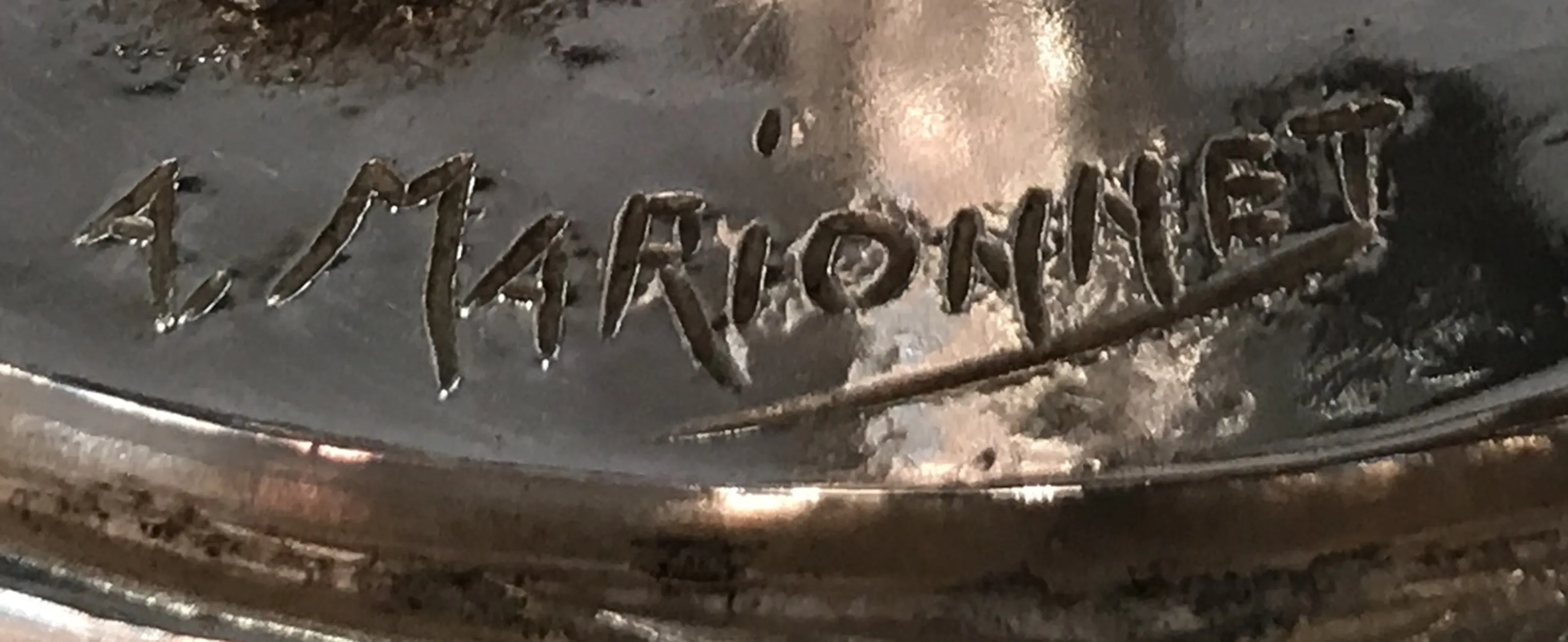 antique seal featuring a. marionnet signature