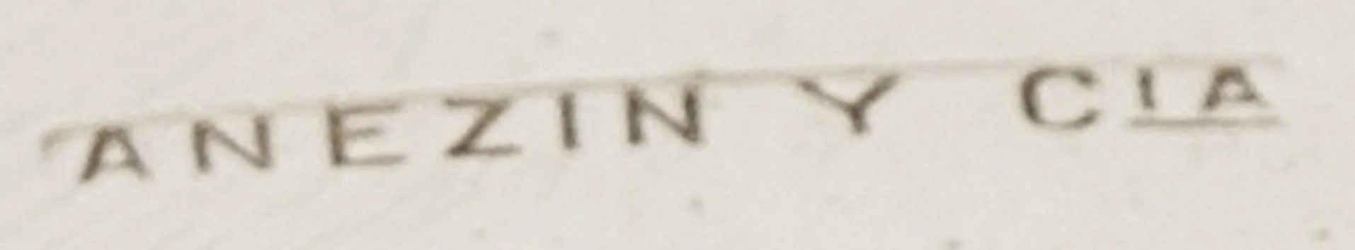 antique seal Anezin y Cia on light background, with visible details.