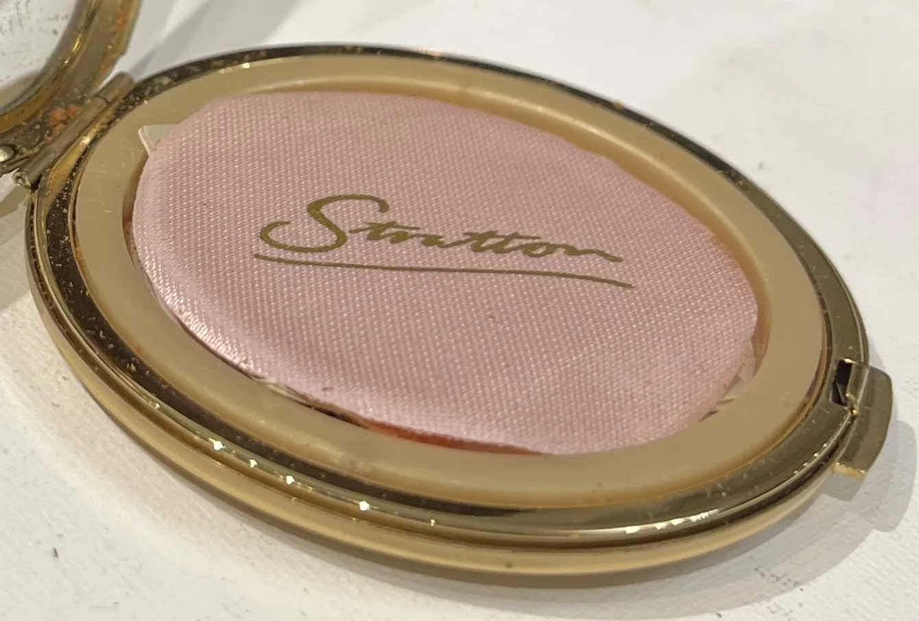 antique Stratton seal, pink and gold texture