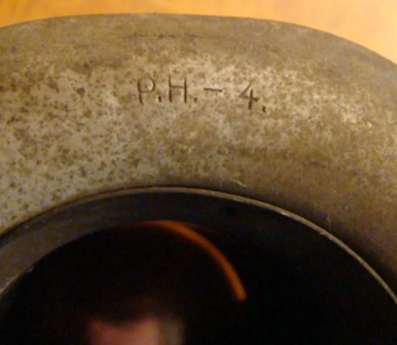 antique seal P.H-4 with visible engravings and classic surroundings