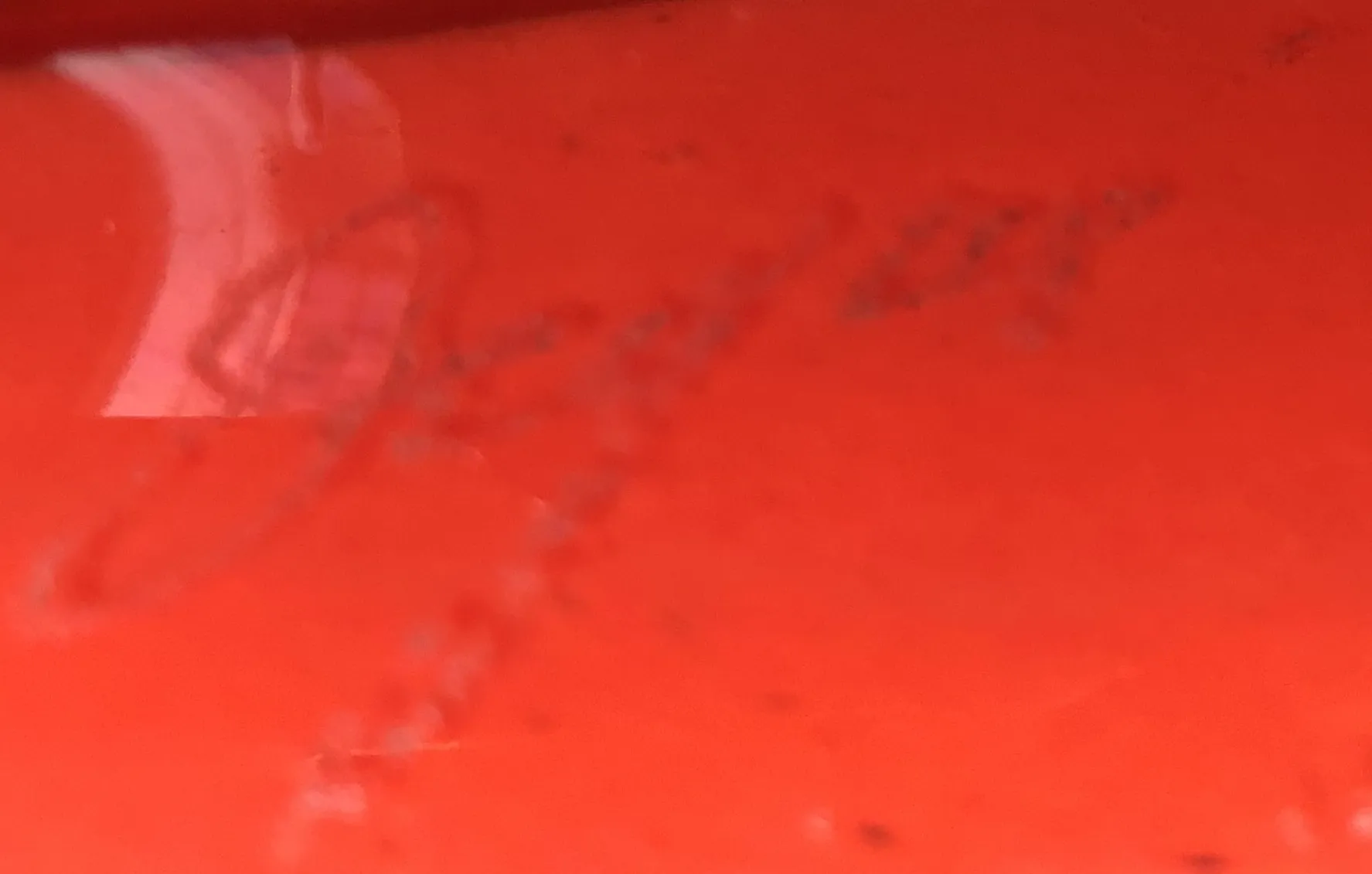 antique seal Degue with visible details on a red surface