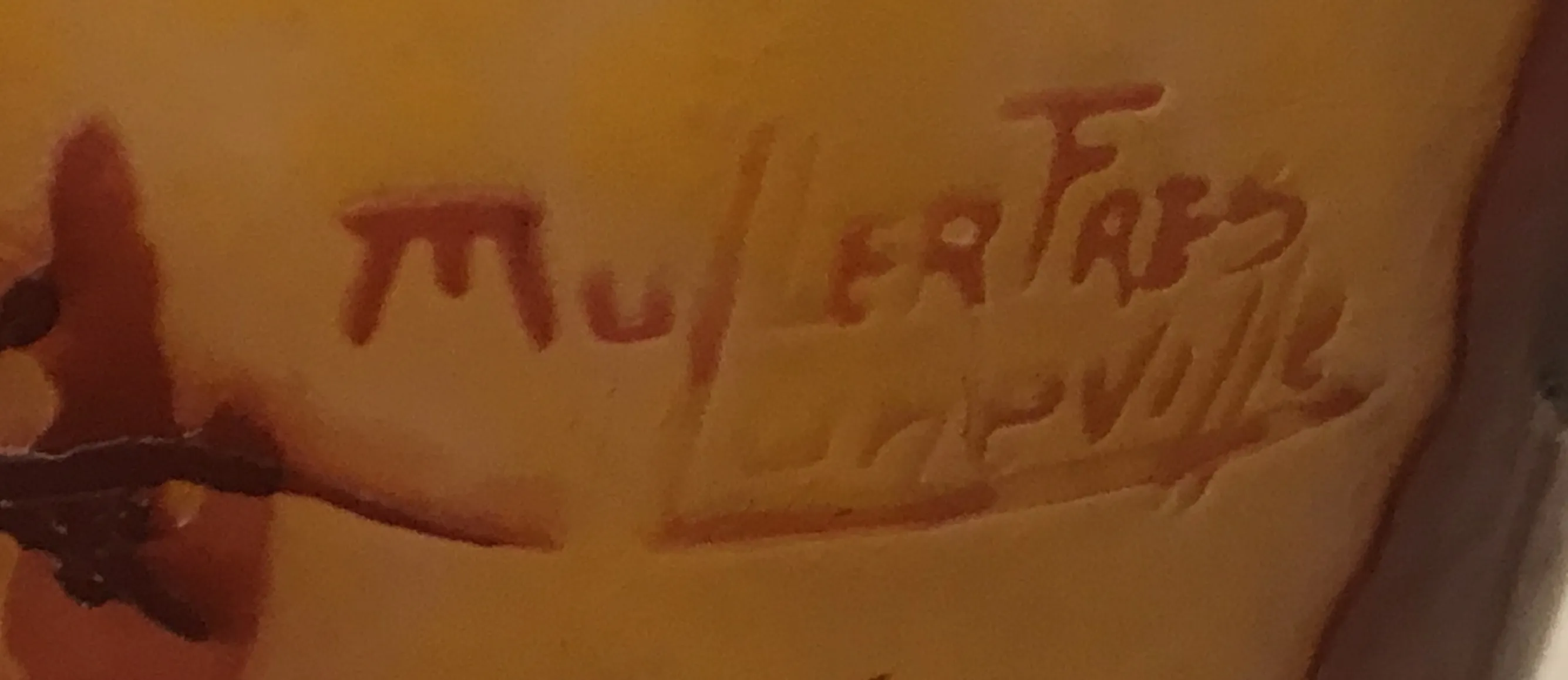 Antique seal displaying inscriptions of Muller Fres Lunéville, visible details.