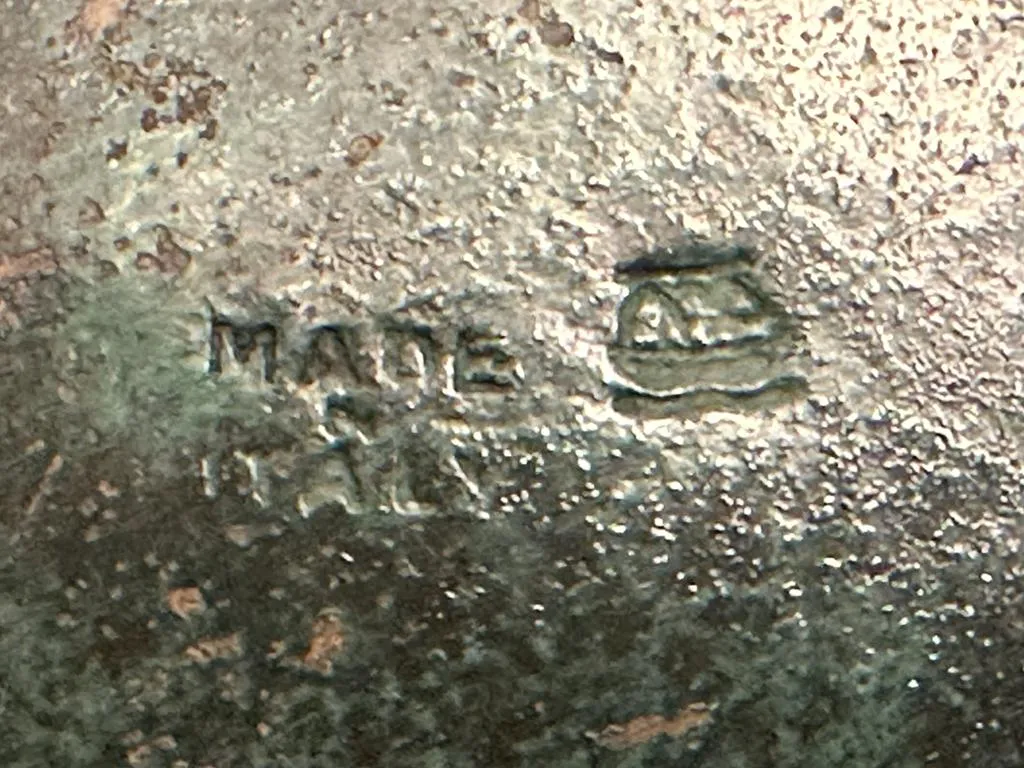 antique seal featuring made italy inscription with a worn texture