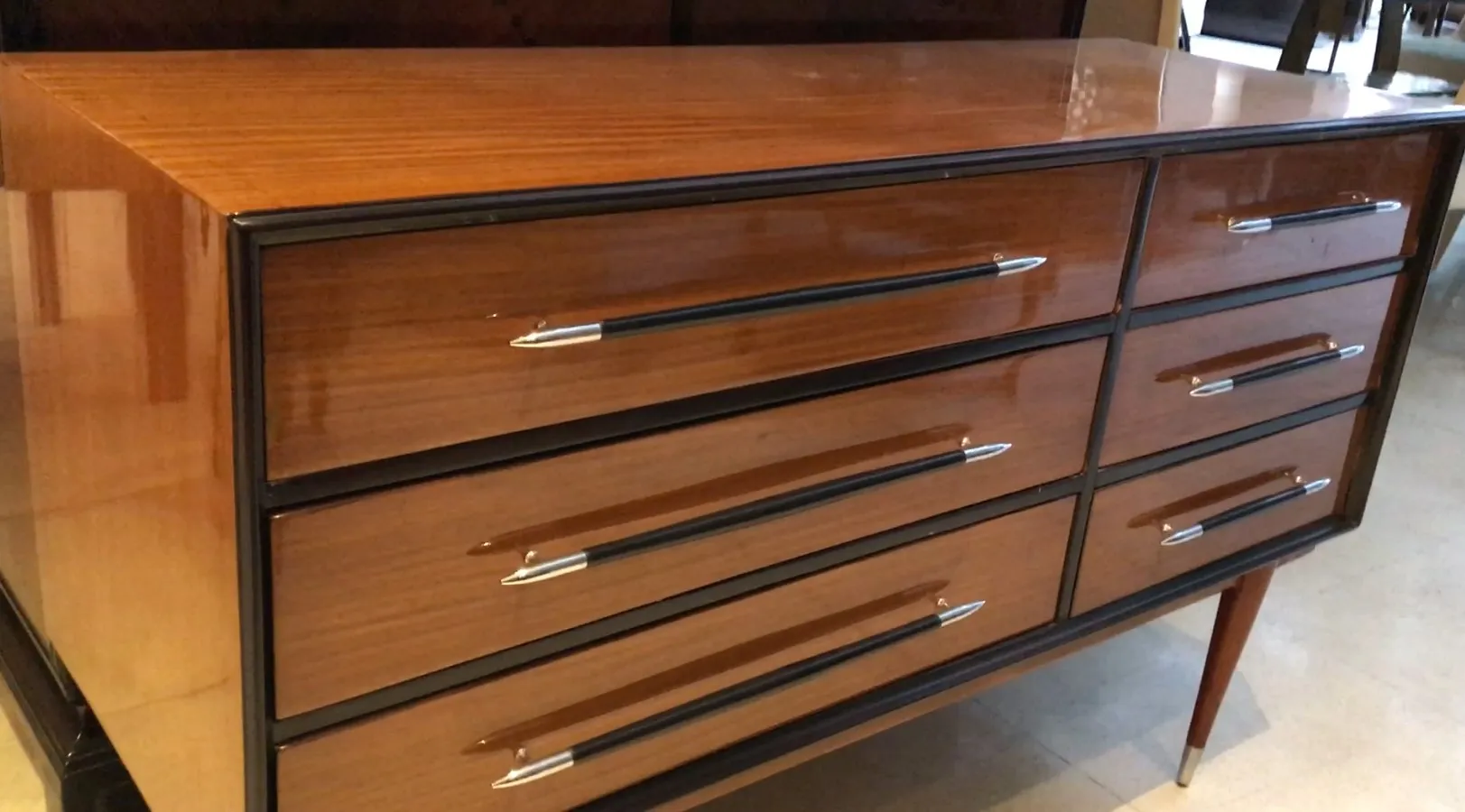 Antique wooden cabinet with four stylish drawers.