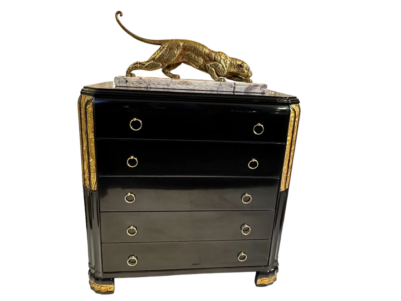 Antike schwarze Schublade mit goldenen Akzenten und einer goldenen Figur oben.