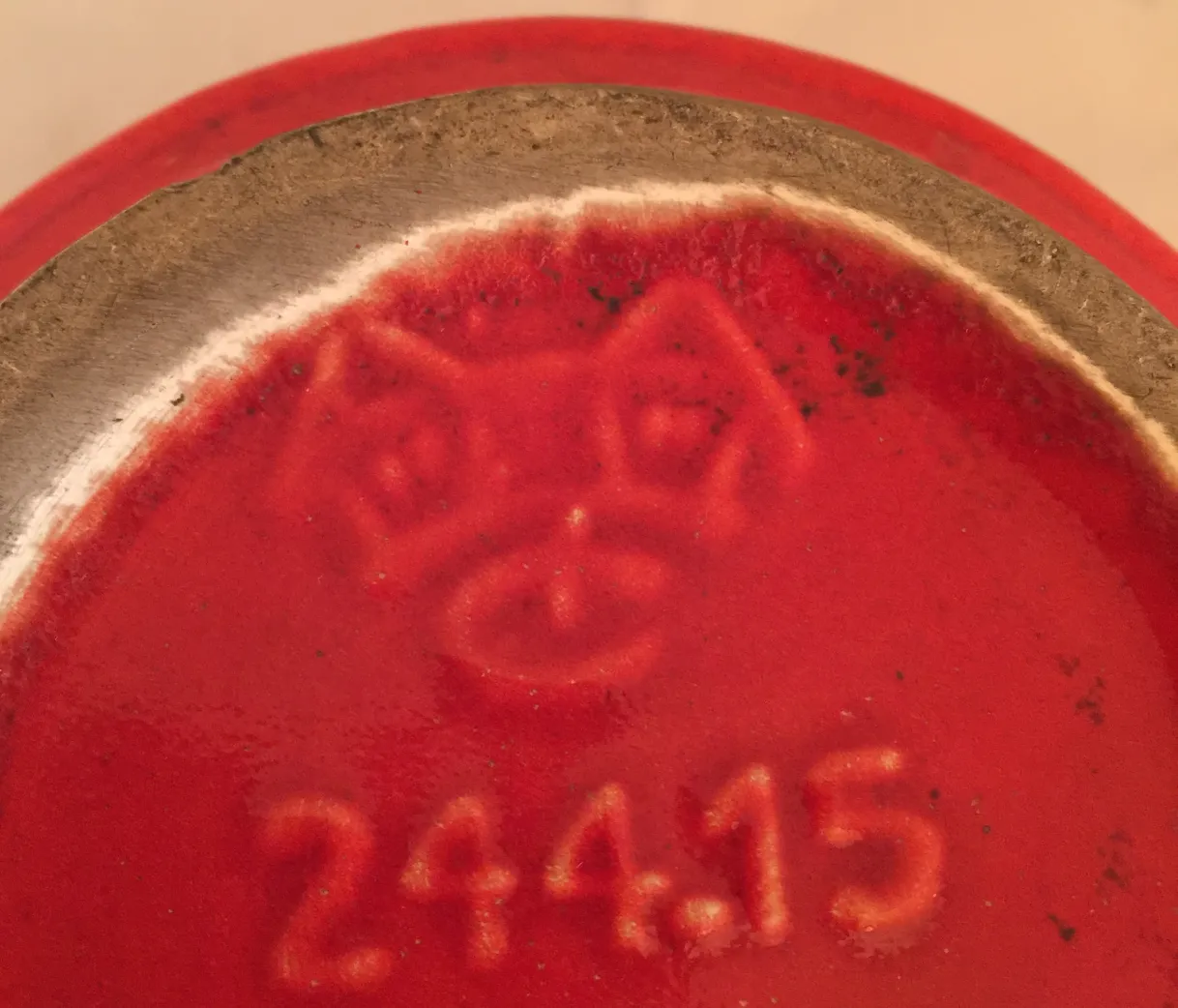 antique ceramic with red decoration and distinctive details