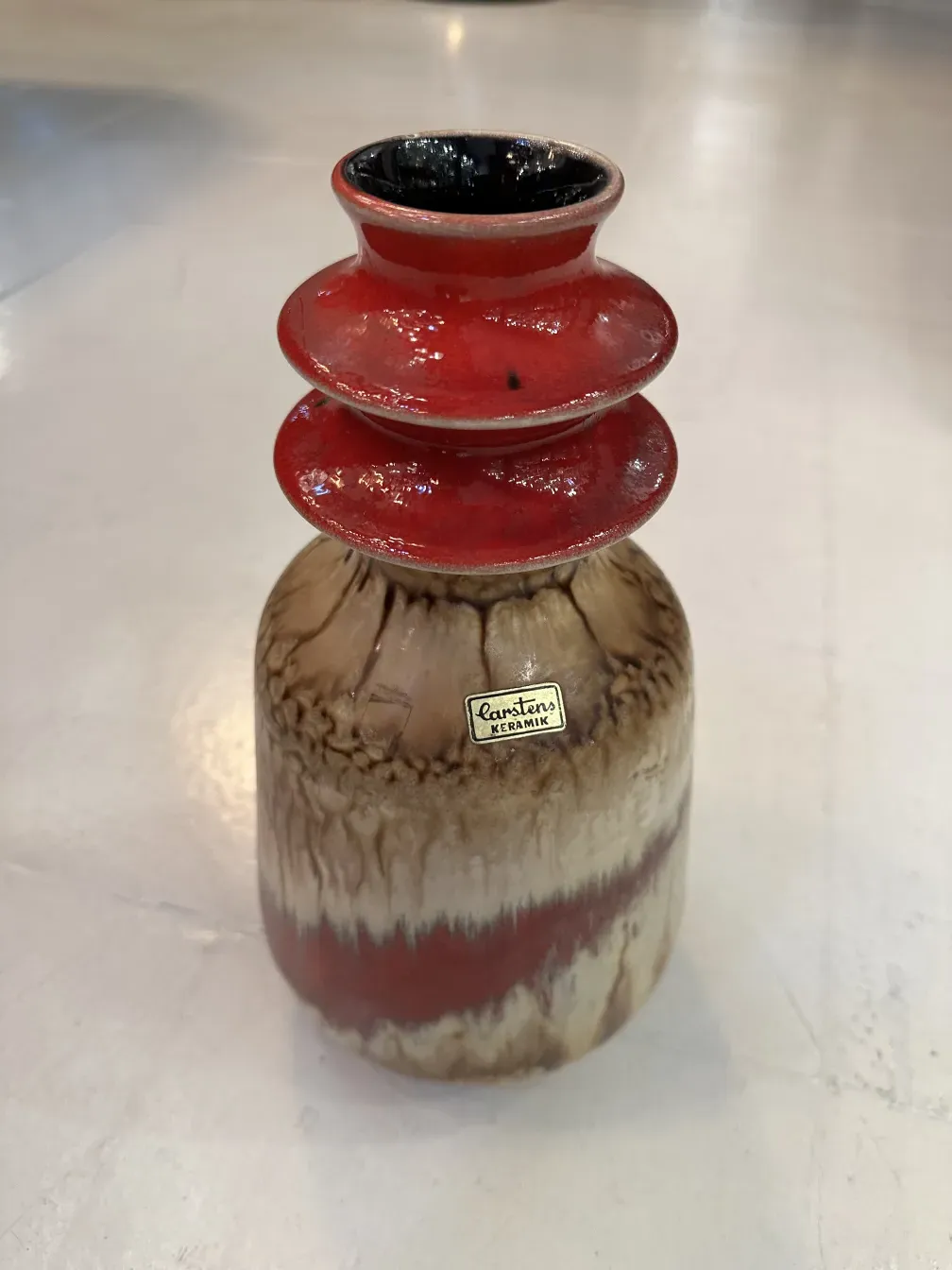 antique ceramic vase with red and brown details