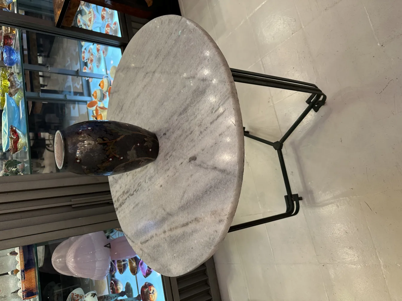 Antique ceramic vase on marble table in elegant setting