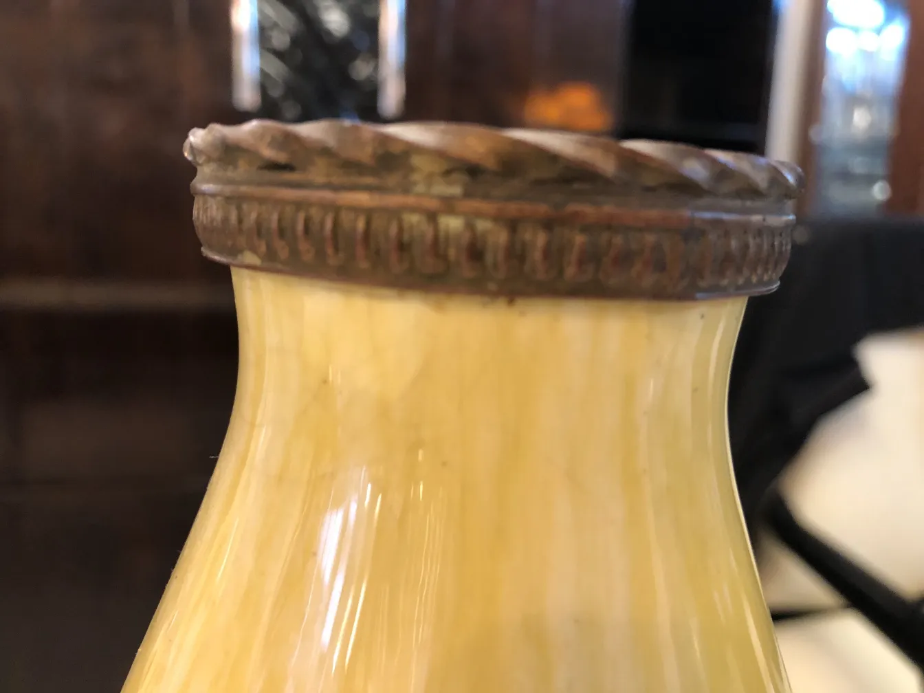 Antique yellow ceramic decorative bottle with metal lid