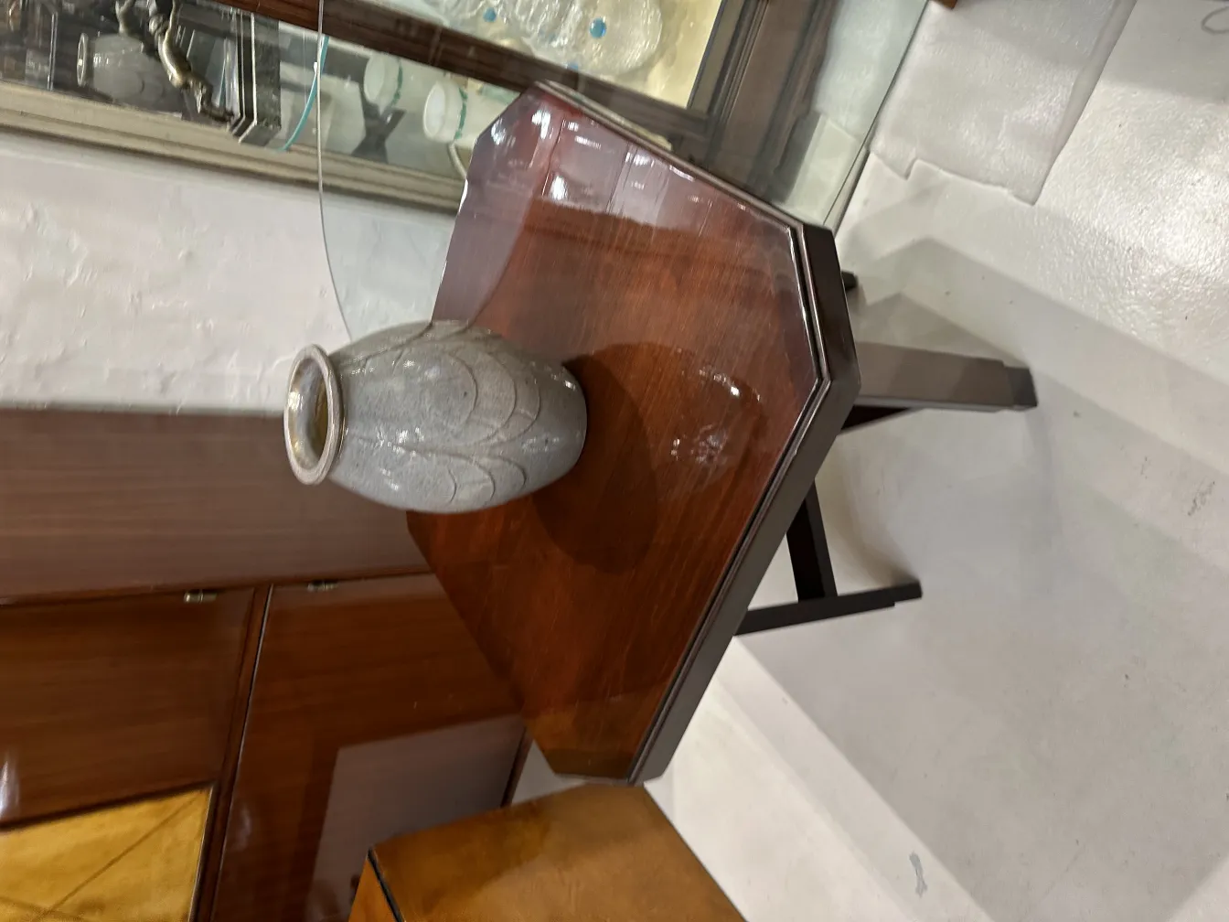 Antique decorative ceramic vase on a wooden table.