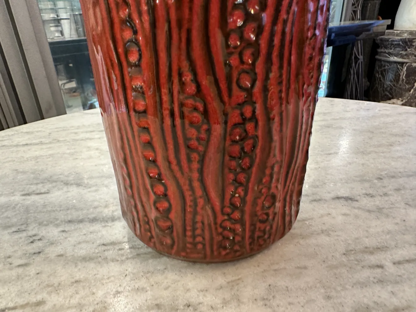 Antique ceramic vase with red texture and finishes