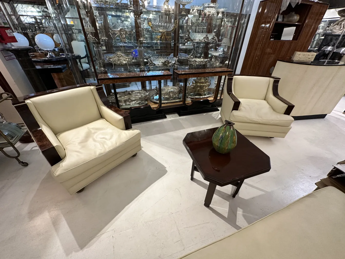 Antique ceramic vase in a classic environment with armchairs.