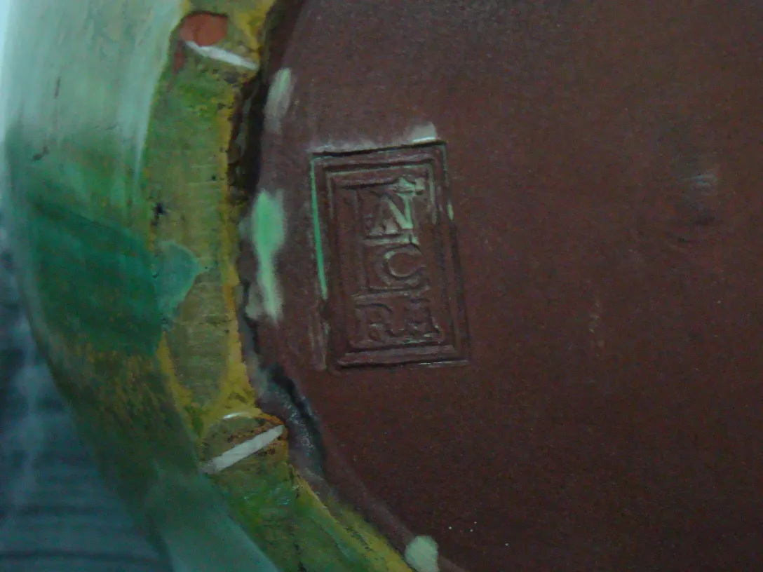 Colorful antique ceramic with artisan details, side view