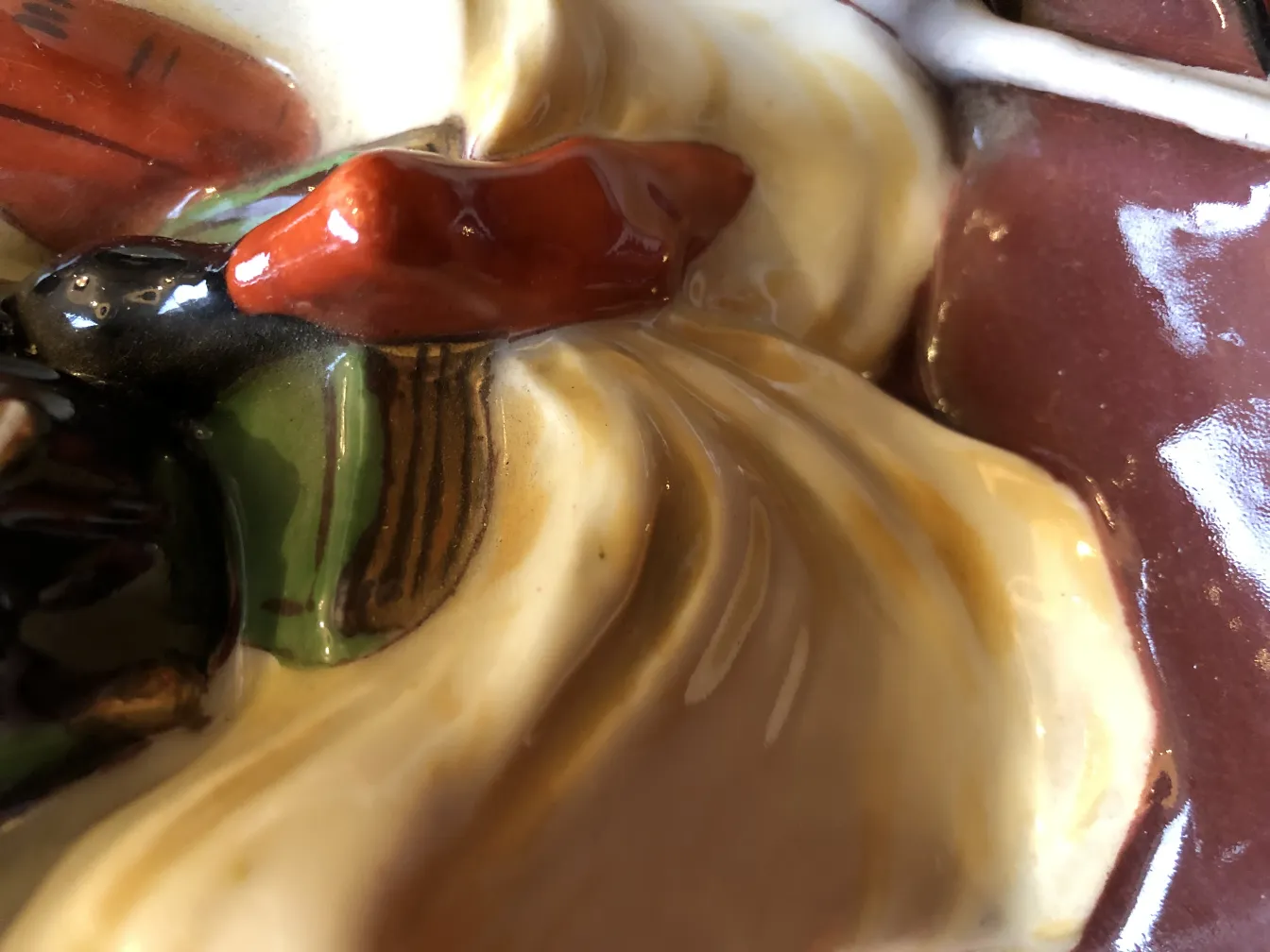 Close-up of antique decorative ceramics with vibrant details.