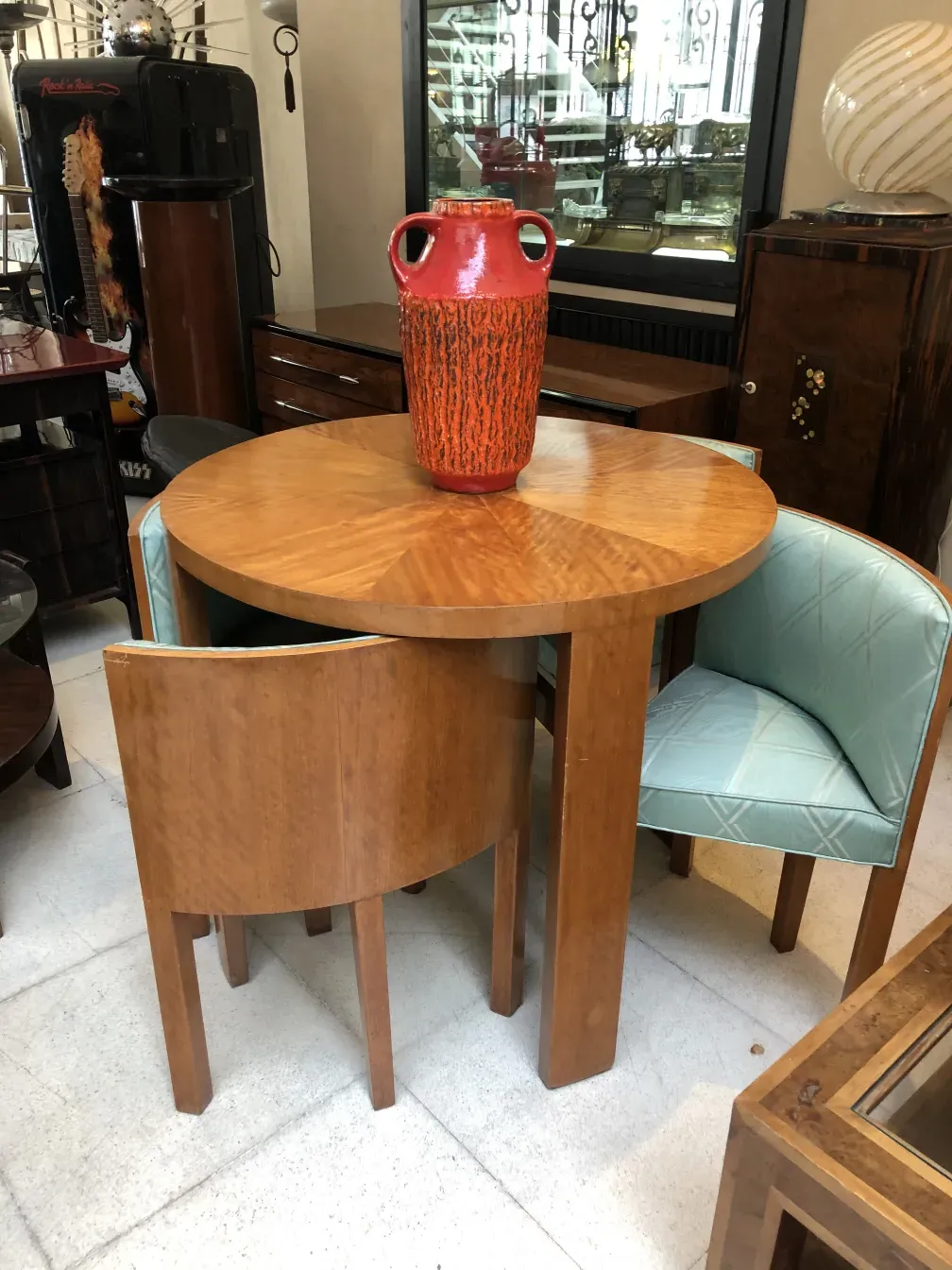Antique carstens-tonnieshof orange vase on a wooden table.