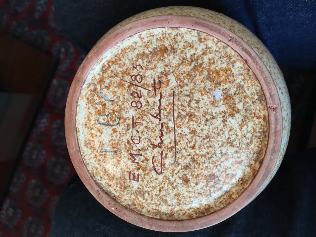 Base of antique ceramic with visible signature and appealing texture.