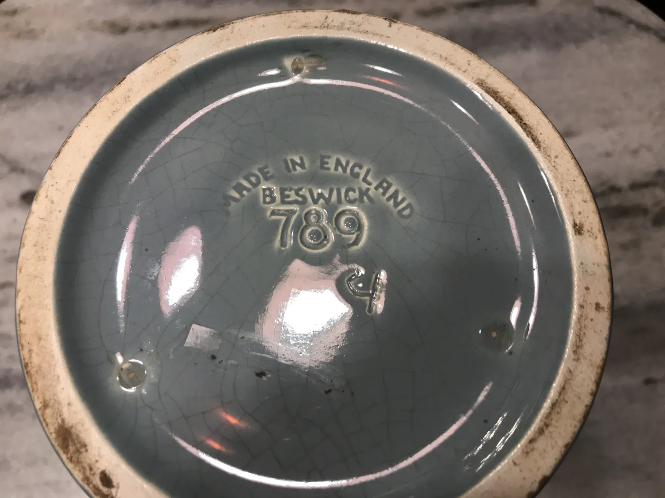 Base of antique ceramic with Beswick inscription, blue color.