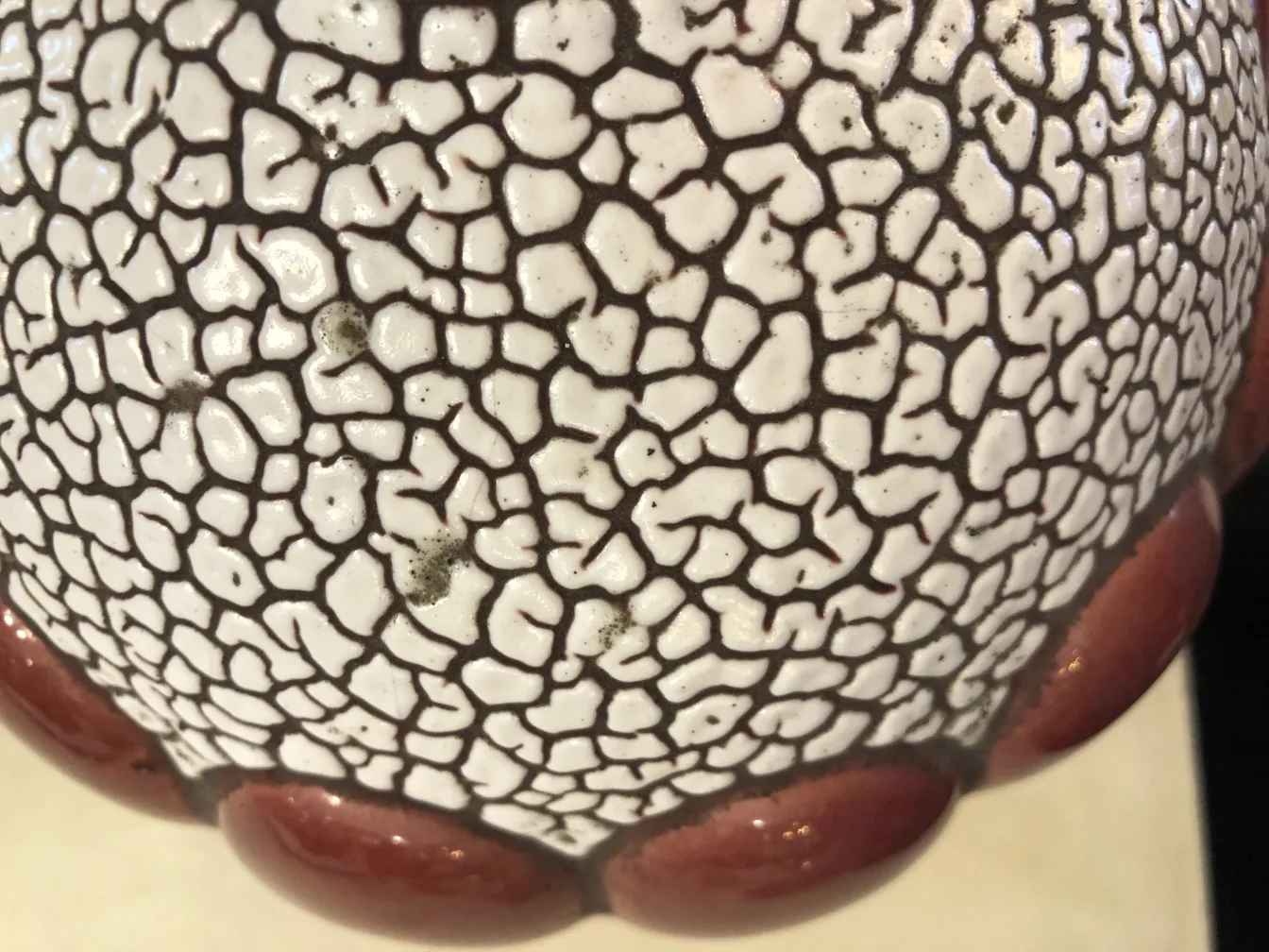 detail of an antique ceramic with bright texture and red edge
