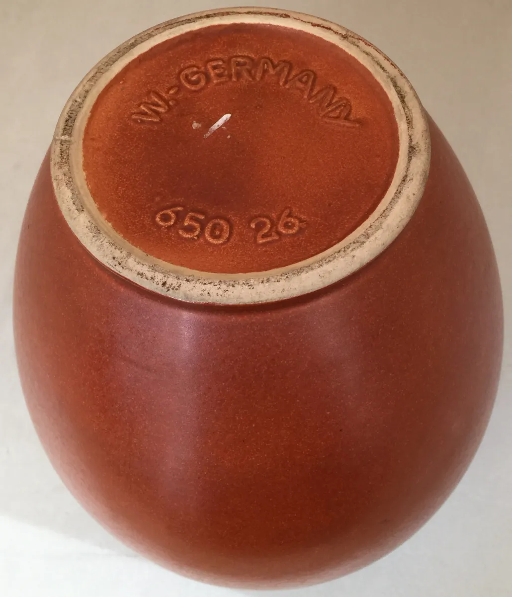 Antique Bertelmann ceramic, terracotta color, round shape.