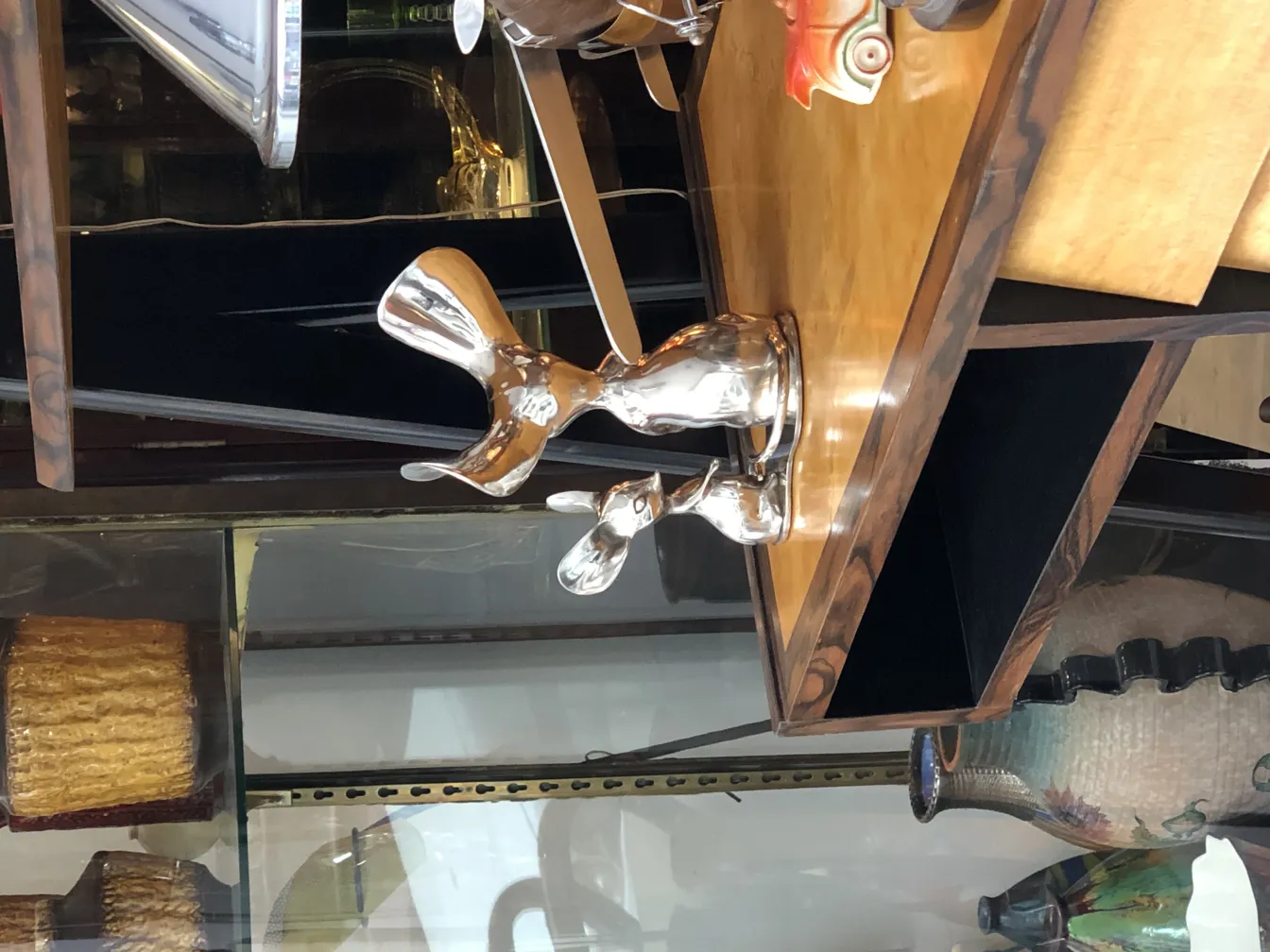 Ancient sculpture with modern shiny shapes.