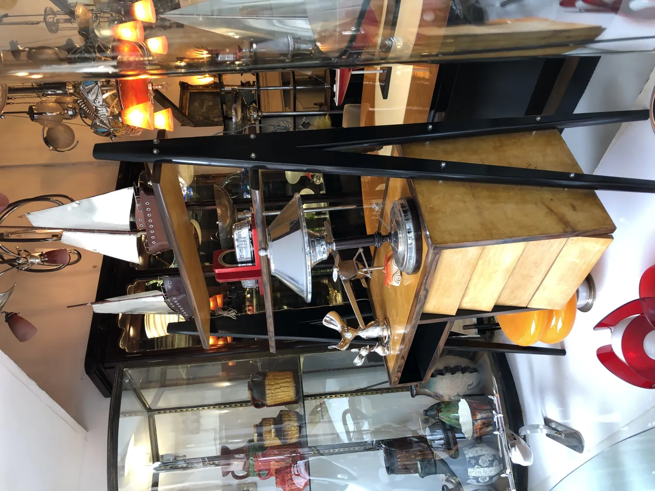 Antique sculpture in an antique setting with various decorative pieces.