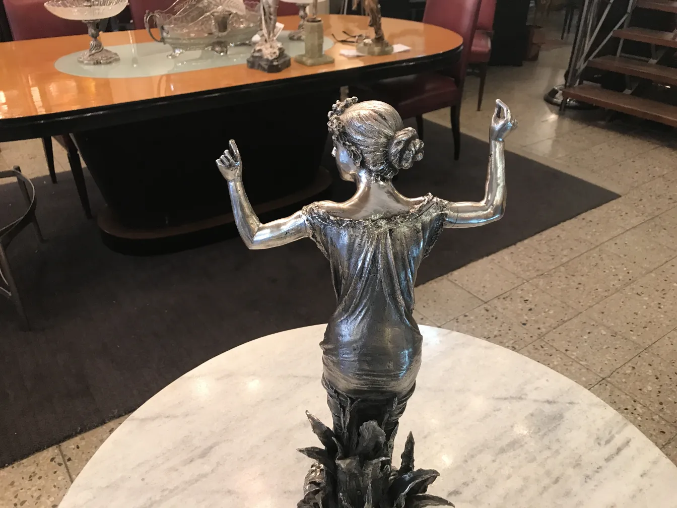 Depiction of a lady in an antique silver sculpture, decorative.