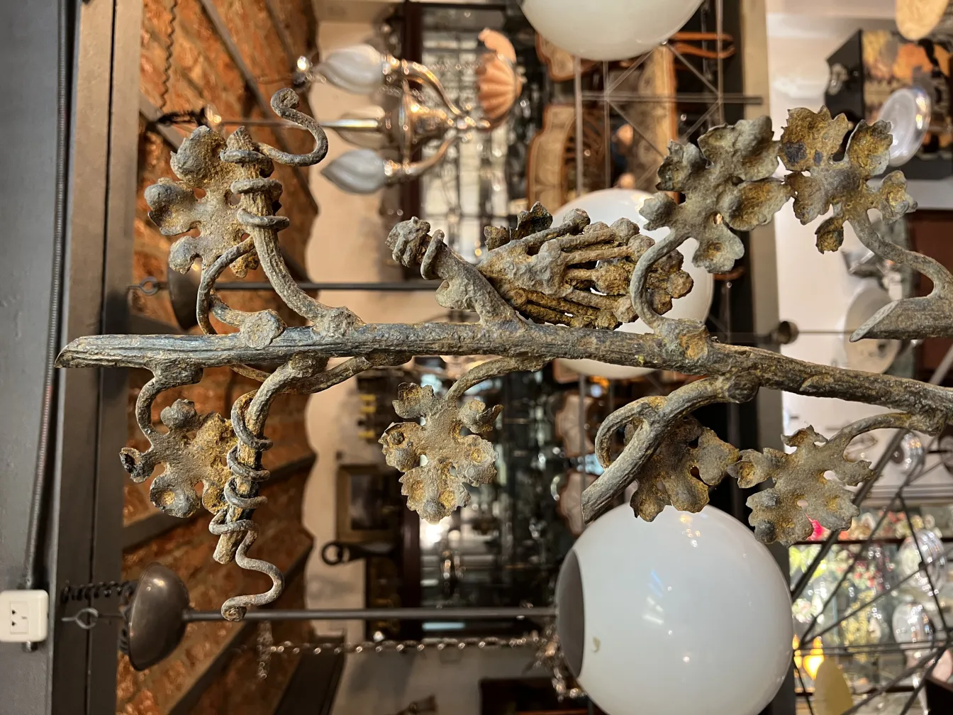 Antique sculpture depicting a branch with leaves, antique ambiance