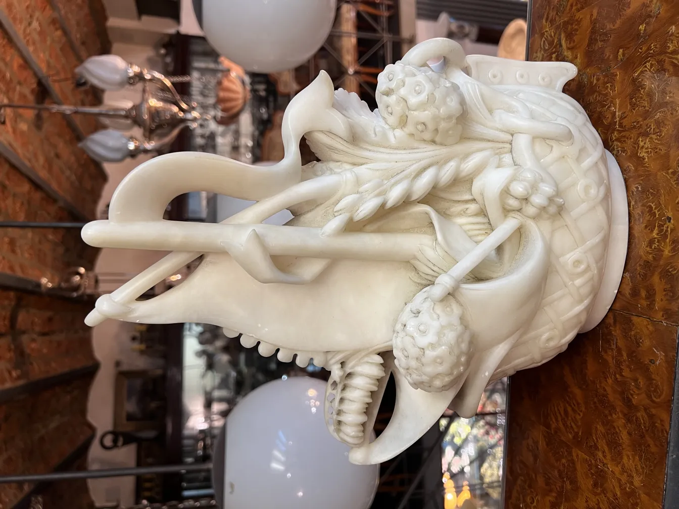 Ancient sculpture in marble with subtle decorative details.