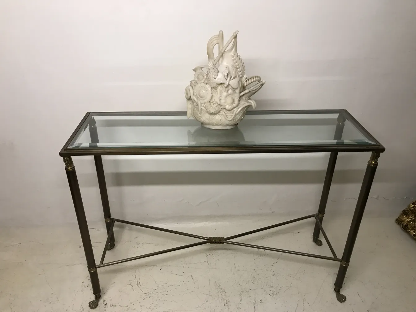 Antique ceramic sculpture on glass table