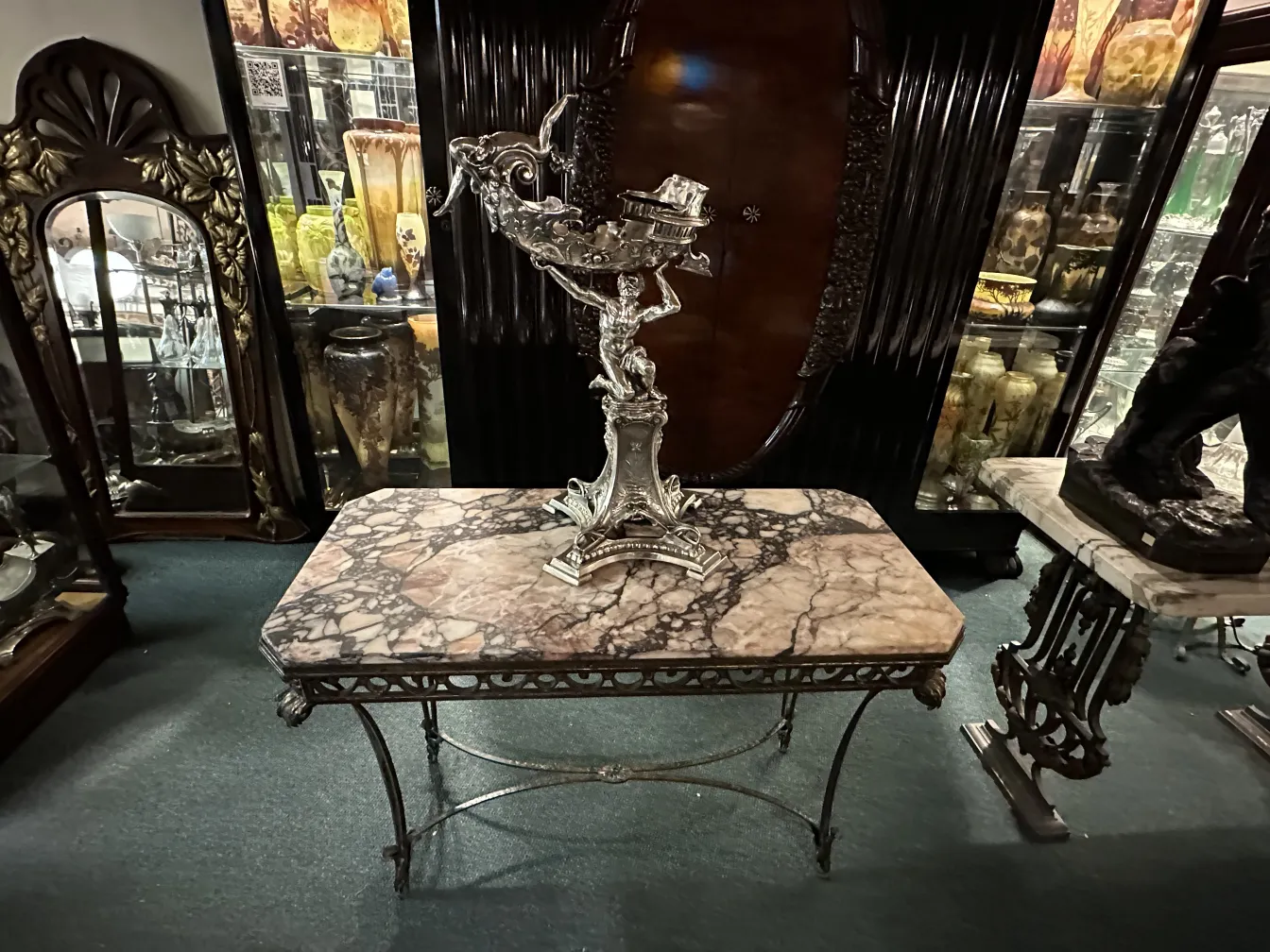 Antique decorative sculpture with intricate details in an elegant setting.