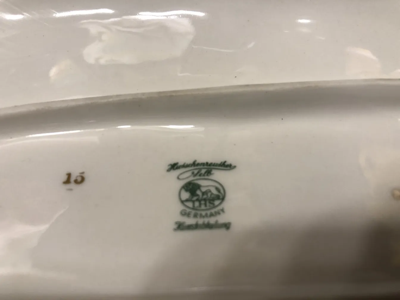 Antique German ceramic with green and gold details.