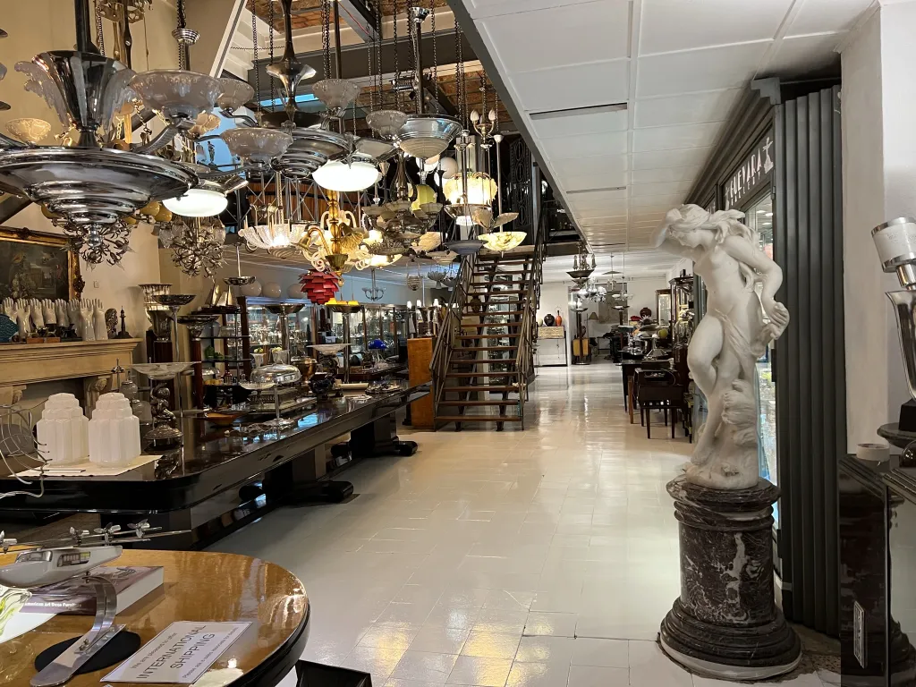 antique sculpture with figures in an antique setting