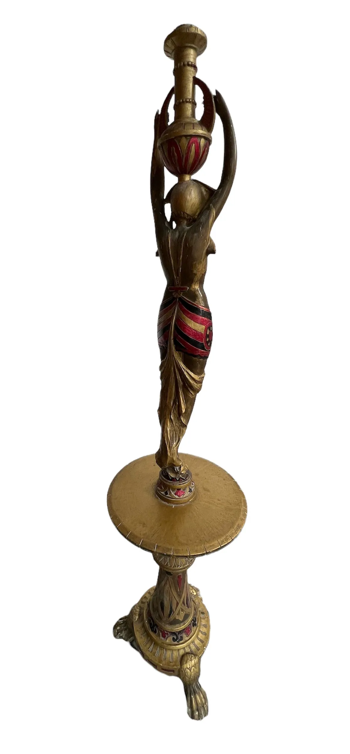 antique sculpture of female figure holding a lamp, with decorative pedestal