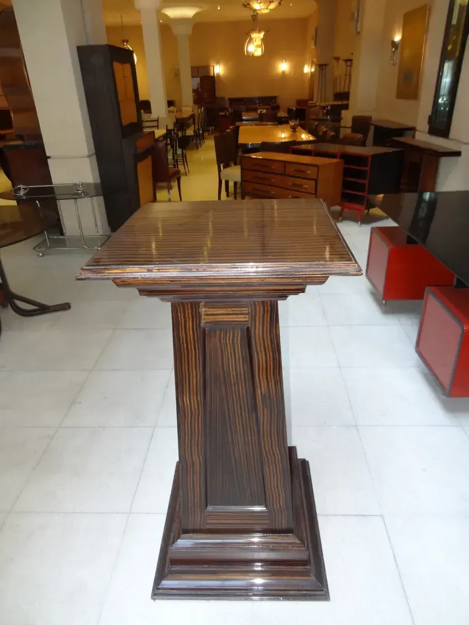 Antique column in a classic setting with wooden furniture.