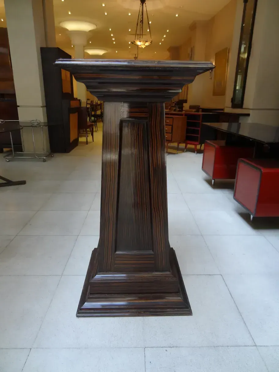 image of an antique decorative column in a modern setting