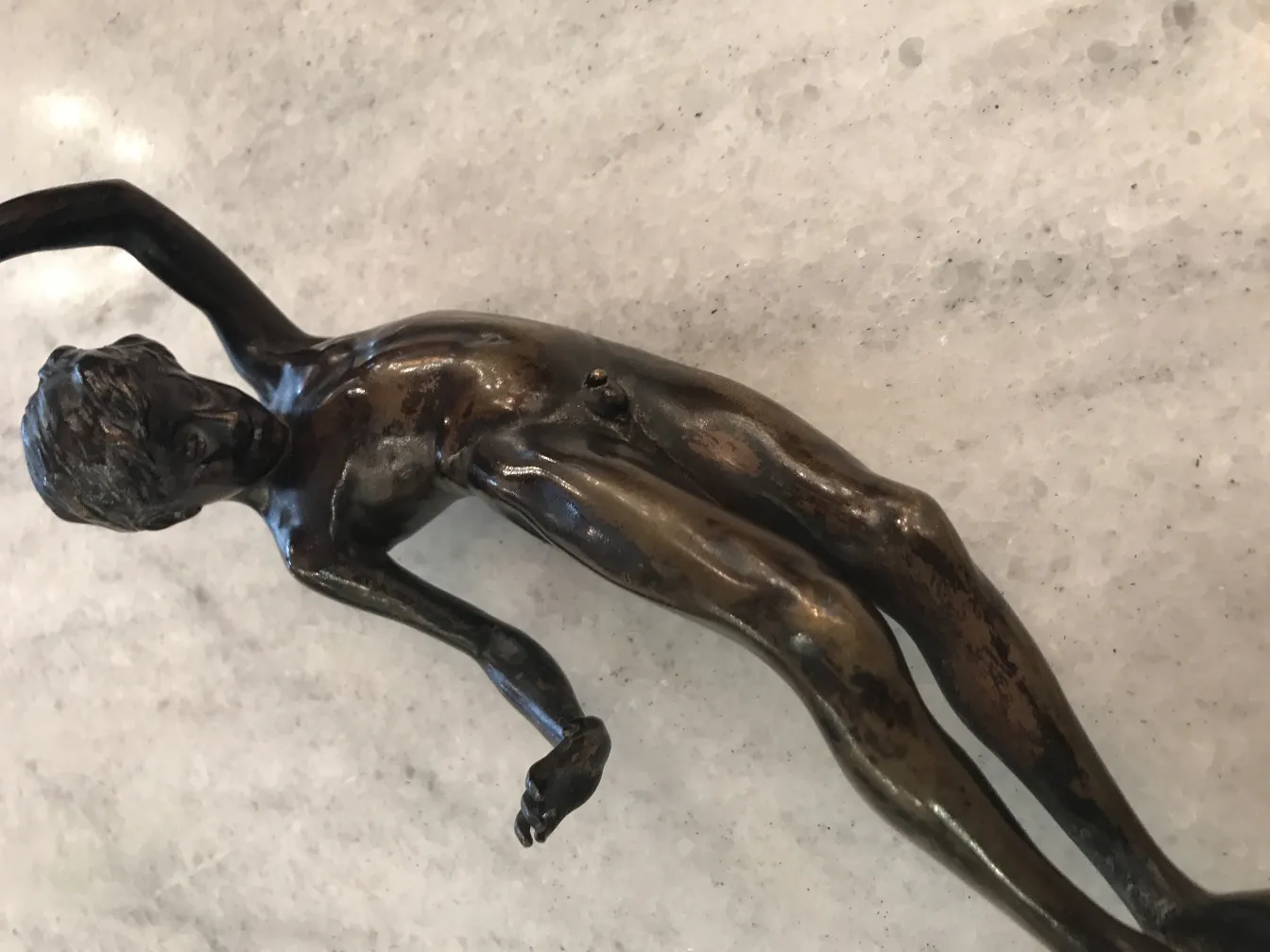 ancient sculpture of human figure in natural pose