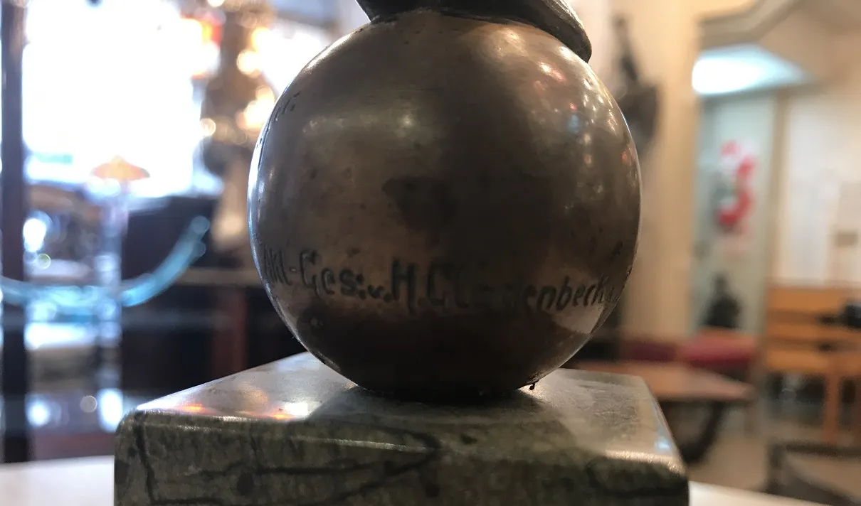 antique decorative sculpture in an antiques setting