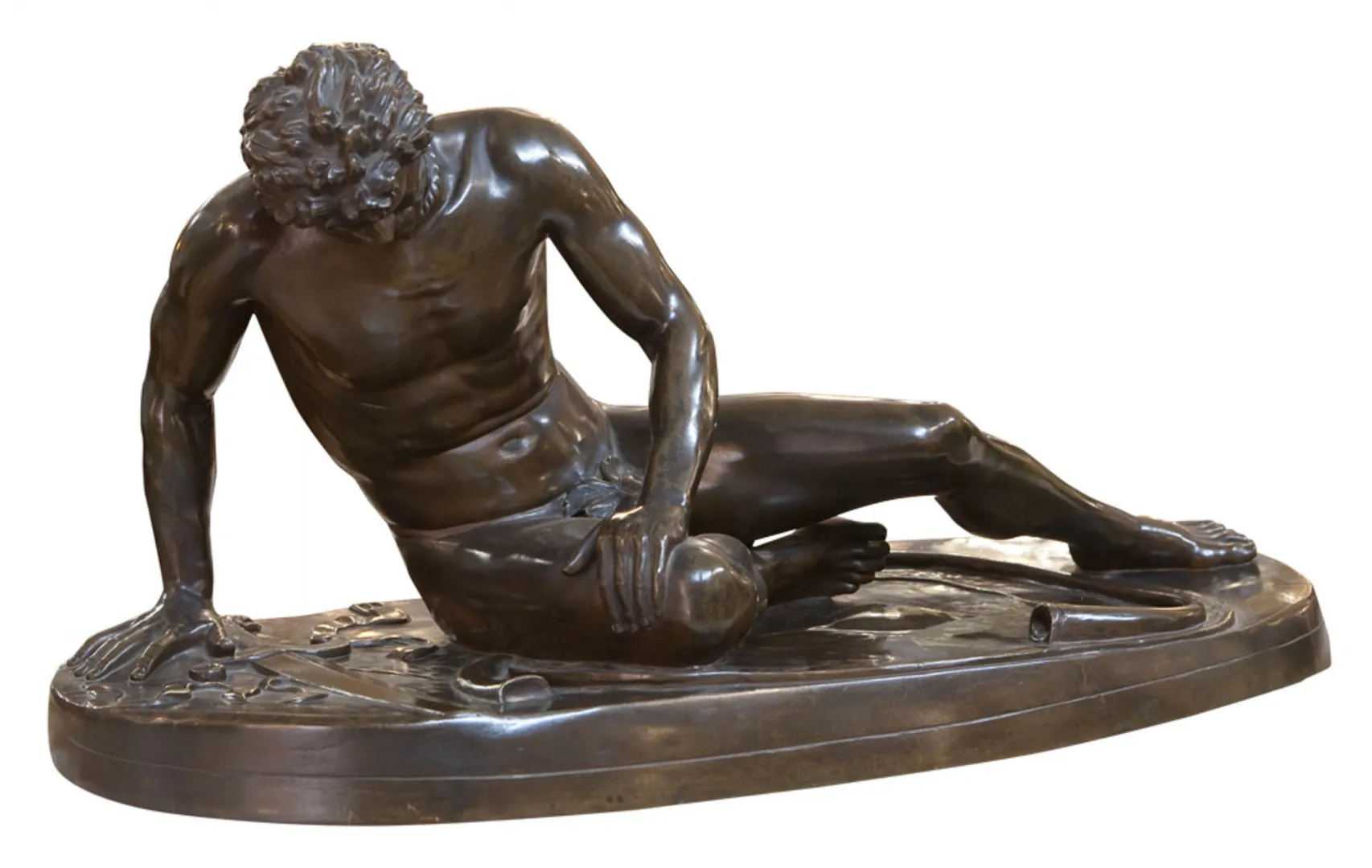 ancient sculpture of human figure in reclining position