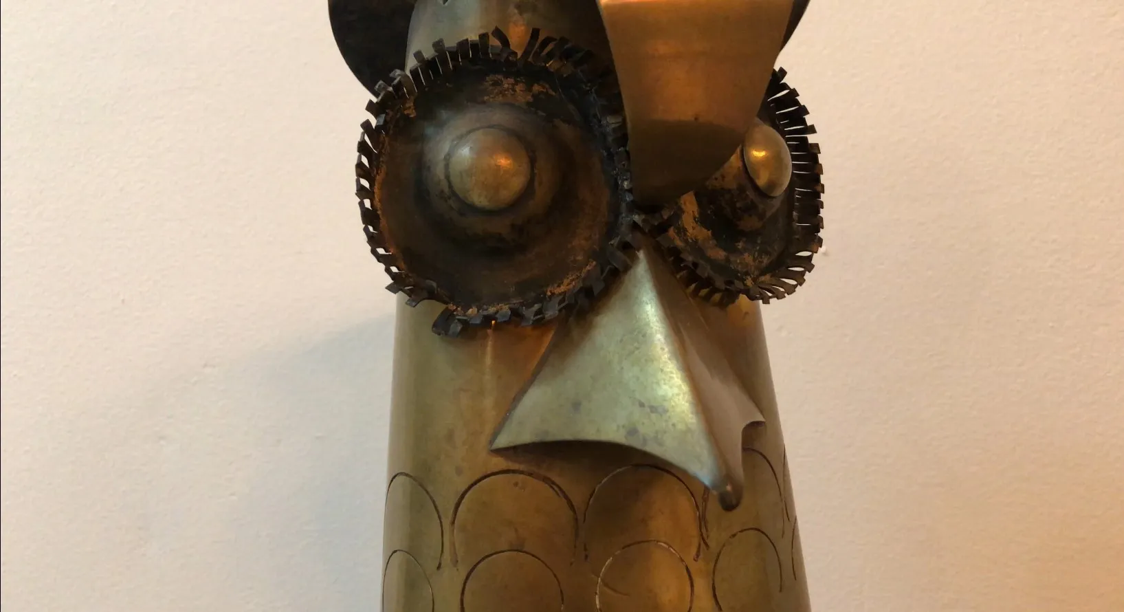 antique sculpture with gear eyes, decorative figure